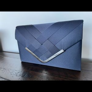 La regale- Crisscross Satin Envelope Clutch ( never used )